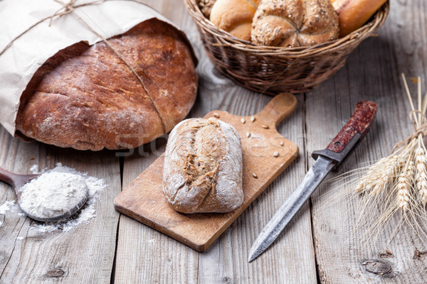Delicious fresh bread on wooden background Stock photo © tommyandone