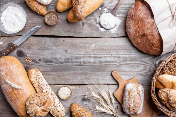 Delicious fresh bread on wooden background Stock photo © tommyandone