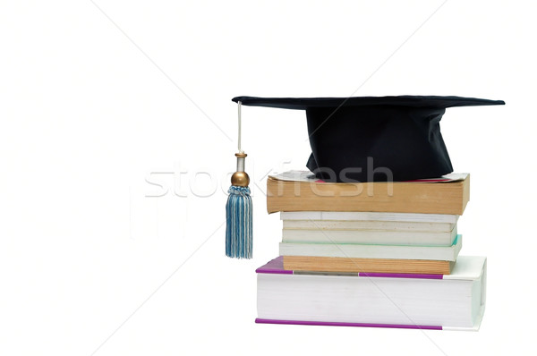 Graduation cap on top of a stack of books Stock photo © tony4urban