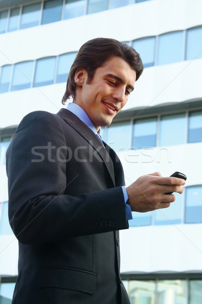 Biznesmen telefonu komórkowego telefonu budynku pracy telefon Zdjęcia stock © toocan
