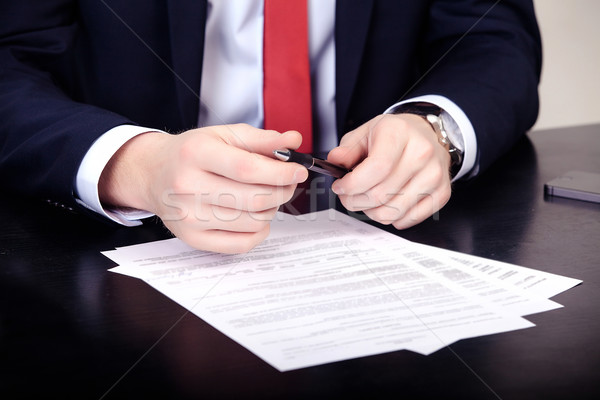 Close-up of male hands with pen over document Stock photo © traza