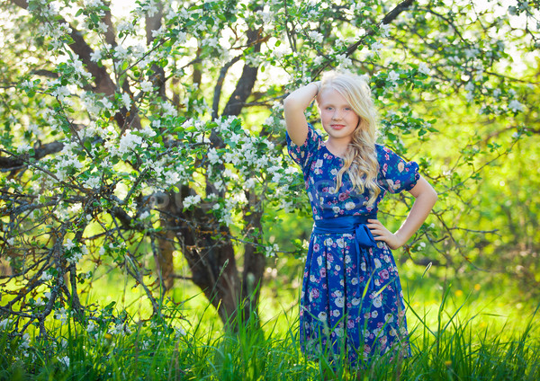 Adorable kid playing in nature. Cute little child, blonde toddler girl playing in blooming cherry ga Stock photo © traza