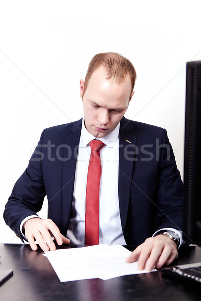 Office worker signs a contract in the workplace. On the table, c Stock photo © traza