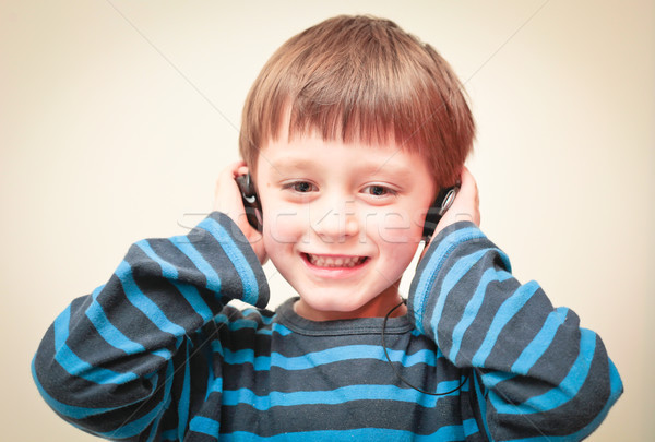 Boy with ear phones Stock photo © trgowanlock