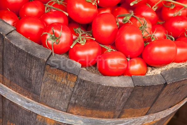 Fresh red tomatoes in a wooden bucket Stock photo © trgowanlock