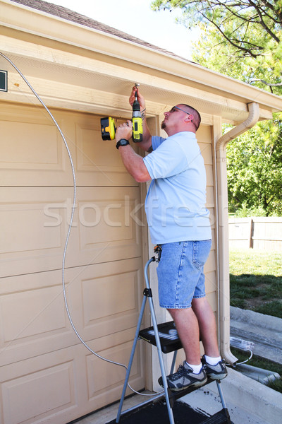 Villanyszerelő installál elektromos kábel frissítés kívül Stock fotó © Trigem4