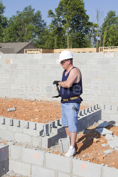 Mason with Concrete Block Stock photo © Trigem4