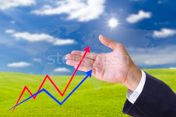 hand bring up the graph in blue sky Stock photo © tungphoto