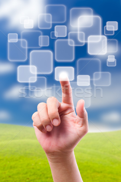 hand pushing button on blue sky Stock photo © tungphoto