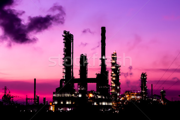 Stock photo: silhouette oil refinery plant and smoke at twilight morning 