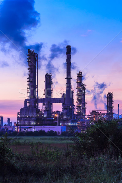 Stock photo: oil refinery plant and smoke at twilight morning 