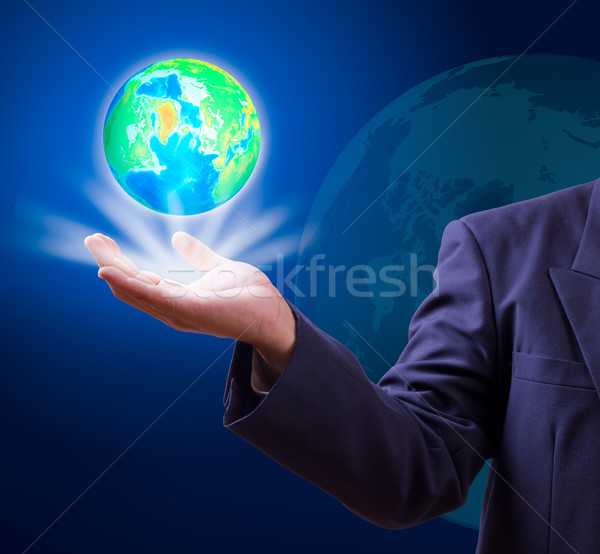 Stock photo: earth globe in hand