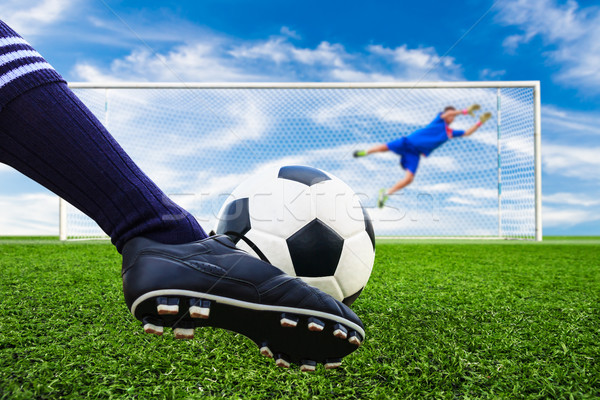 Stock photo: foot shooting soccer ball to goal, penalty