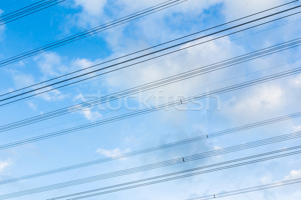 high power voltage cable line against blue sky Stock photo © tungphoto