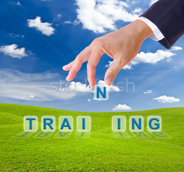 business man hand made training word buttons Stock photo © tungphoto