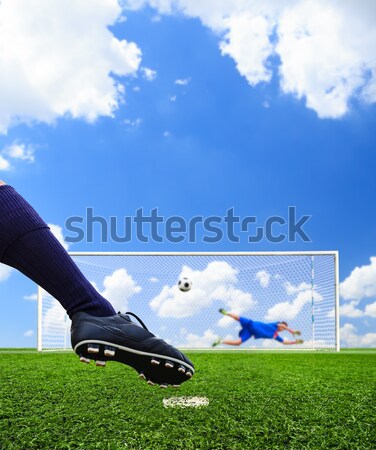 Stock photo: foot shooting soccer ball to goal, penalty