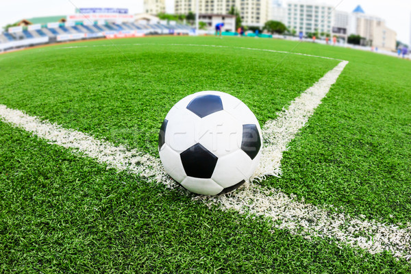 Stock photo: soccer ball on green grass field