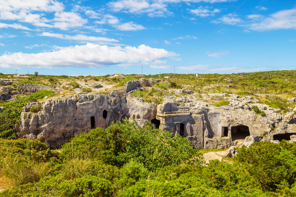 Cala Morell Necropolis Caves in sunny day at Menorca, Spain. Stock photo © tuulijumala