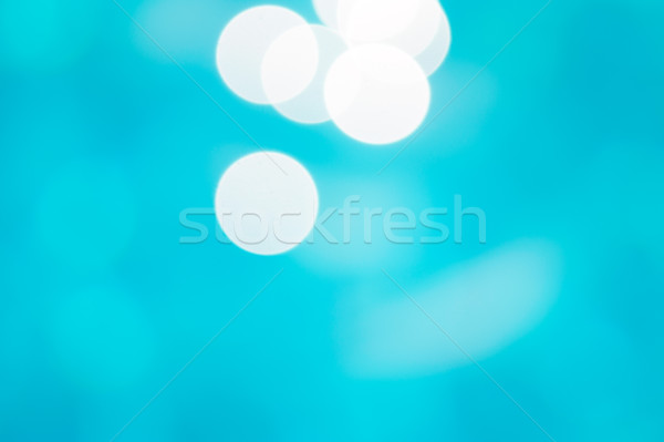 Sunny water bokeh blue background. Stock photo © tuulijumala