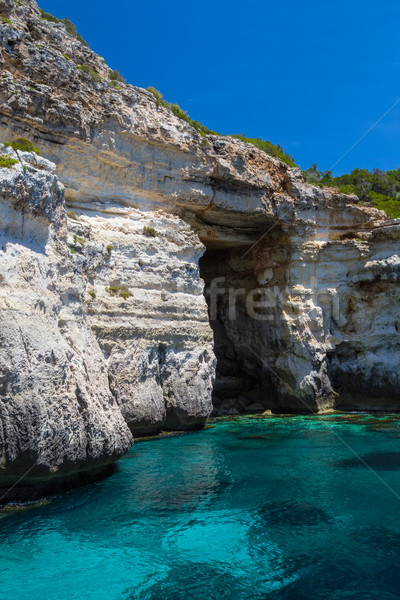 Pirate coast cliff cave at Menorca island, Spain. Stock photo © tuulijumala