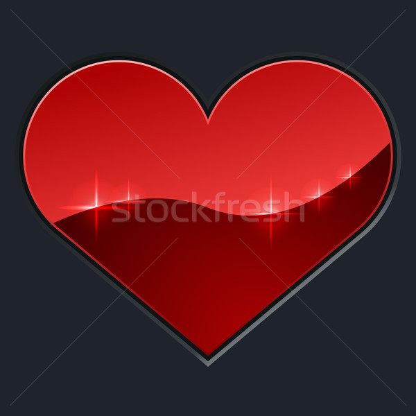 Stock photo: Red glossy heart on dark background.