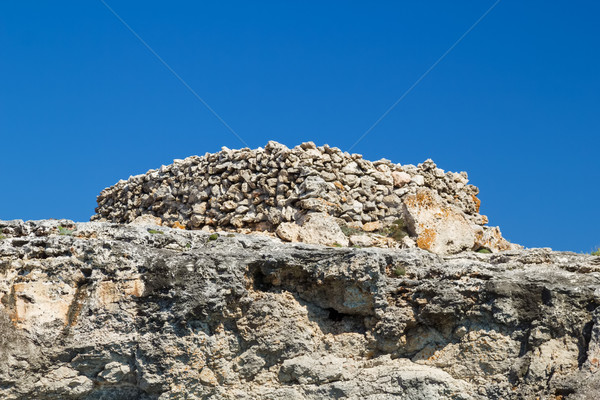 Ancient stone talayot at Menorca island, Spain. Stock photo © tuulijumala