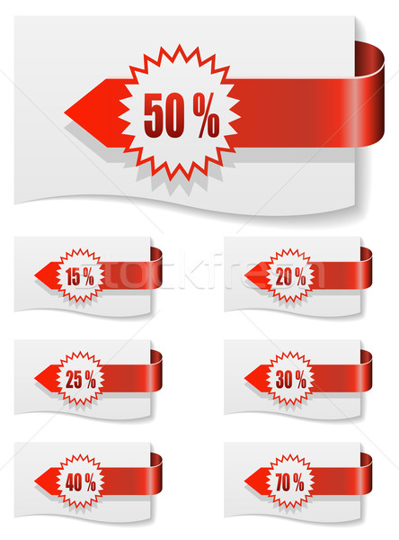 Red discount labels bent around paper. Stock photo © tuulijumala