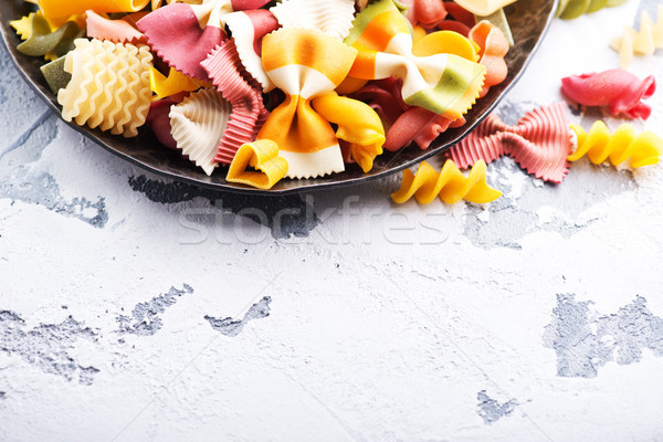 Crudo pasta placa mesa fondo color Foto stock © tycoon