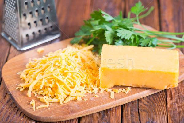 Cheddar fromages bord table orange grasse Photo stock © tycoon