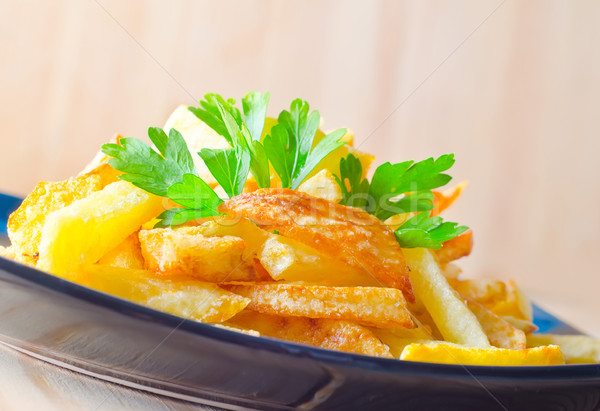 Krumpli étel tányér kövér eszik citromsárga Stock fotó © tycoon