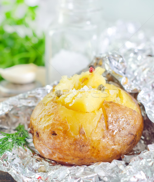 baked potato in foil Stock photo © tycoon