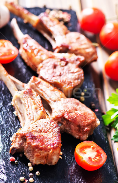 Rack of lamb fried with aromatic olive oil Stock photo © tycoon