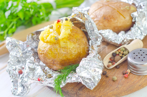 baked potato in foil Stock photo © tycoon