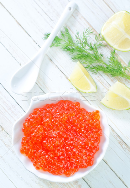 Somon caviar peşte portocaliu placă întuneric Imagine de stoc © tycoon