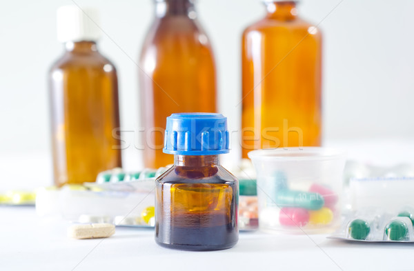 color pills and medical bottle Stock photo © tycoon