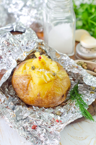 baked potato in foil Stock photo © tycoon