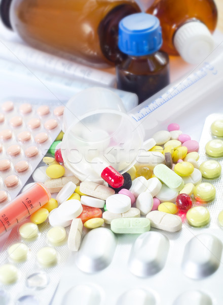 Tabletták háttér csoport üveg piros rózsaszín Stock fotó © tycoon