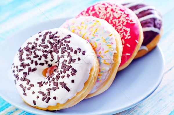 Donuts plaat tabel vruchten cake Blauw Stockfoto © tycoon