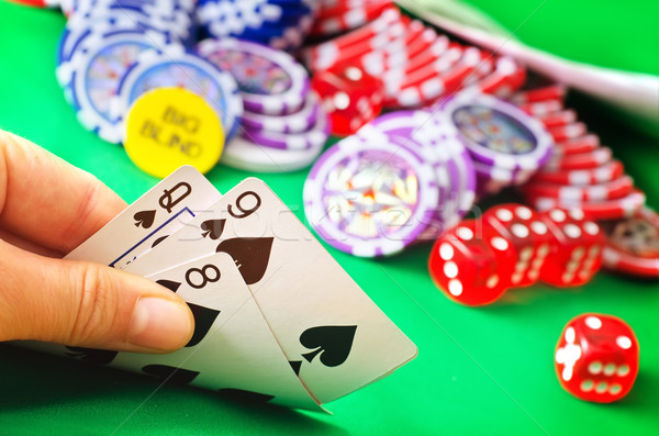 Card for poker in the hand, chips and card for poker Stock photo © tycoon