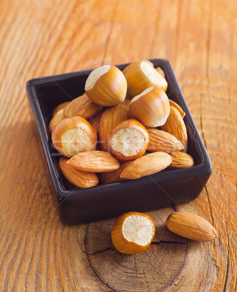nuts in black bowl Stock photo © tycoon