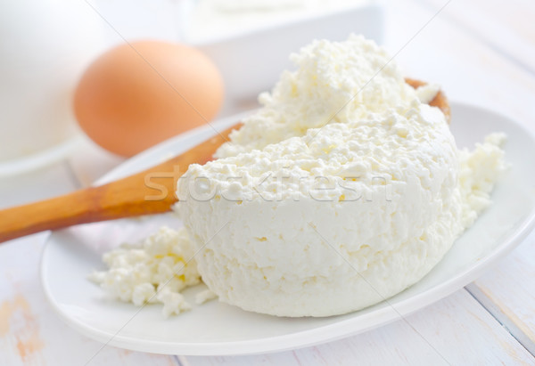Milk products, fresh cottage in the white plate Stock photo © tycoon