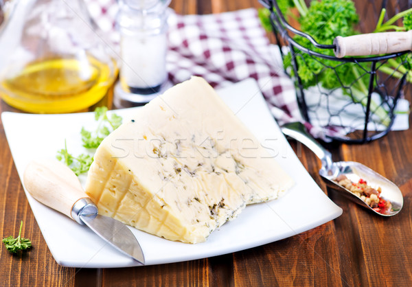 cheese on plate and on a table Stock photo © tycoon