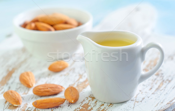 almond essential oil and almond in bowl Stock photo © tycoon