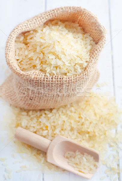 Raw rice on the table, portion of the raw rice Stock photo © tycoon