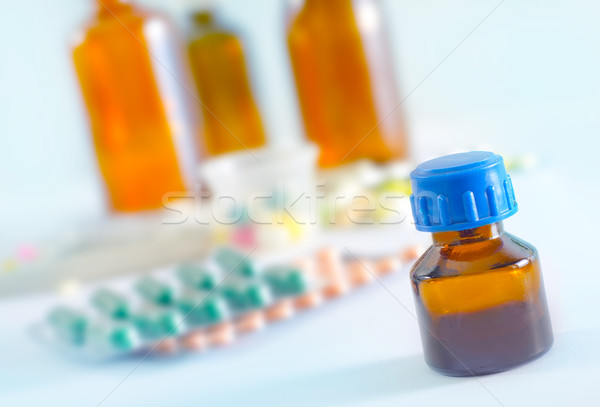 color pills and medical bottle Stock photo © tycoon