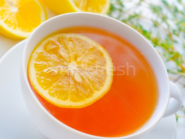 Fresh tea with lemon in the white cup Stock photo © tycoon