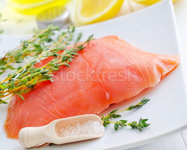Raw salmon on the white plate with thyme and salt Stock photo © tycoon