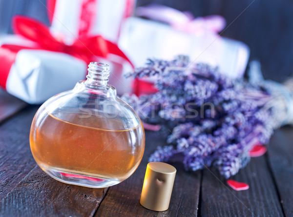 Parfum bouteille table en bois femmes groupe soins [[stock_photo]] © tycoon