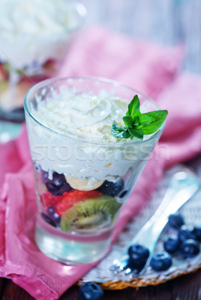Gyümölcssaláta gyümölcs mix tejszínhab üveg természet csoport Stock fotó © tycoon