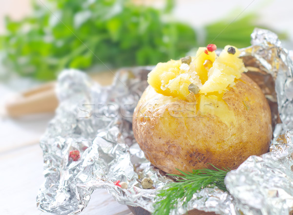 baked potato in foil Stock photo © tycoon